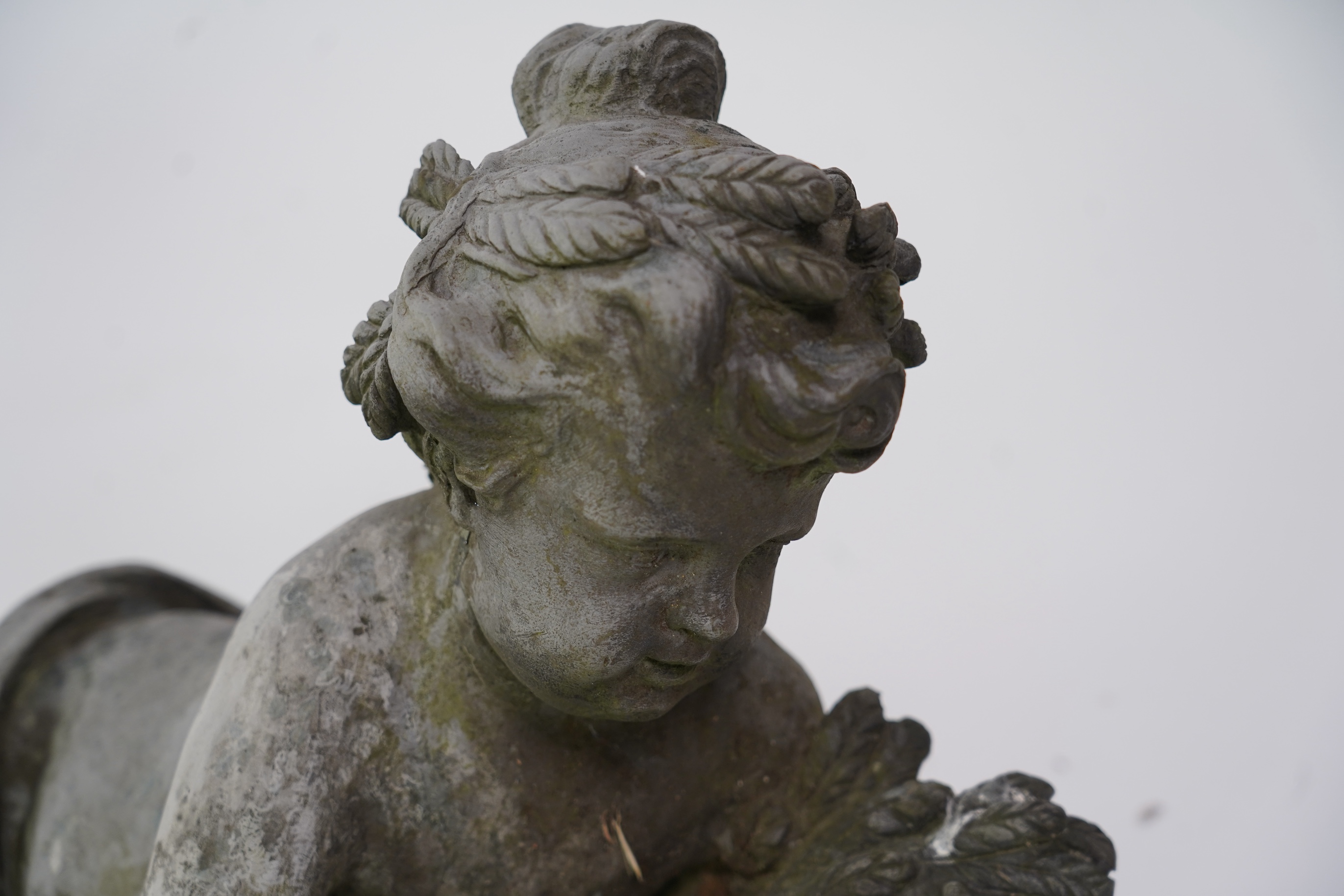 A pair of simulated lead garden sculptures, Emblematic of Summer and Autumn